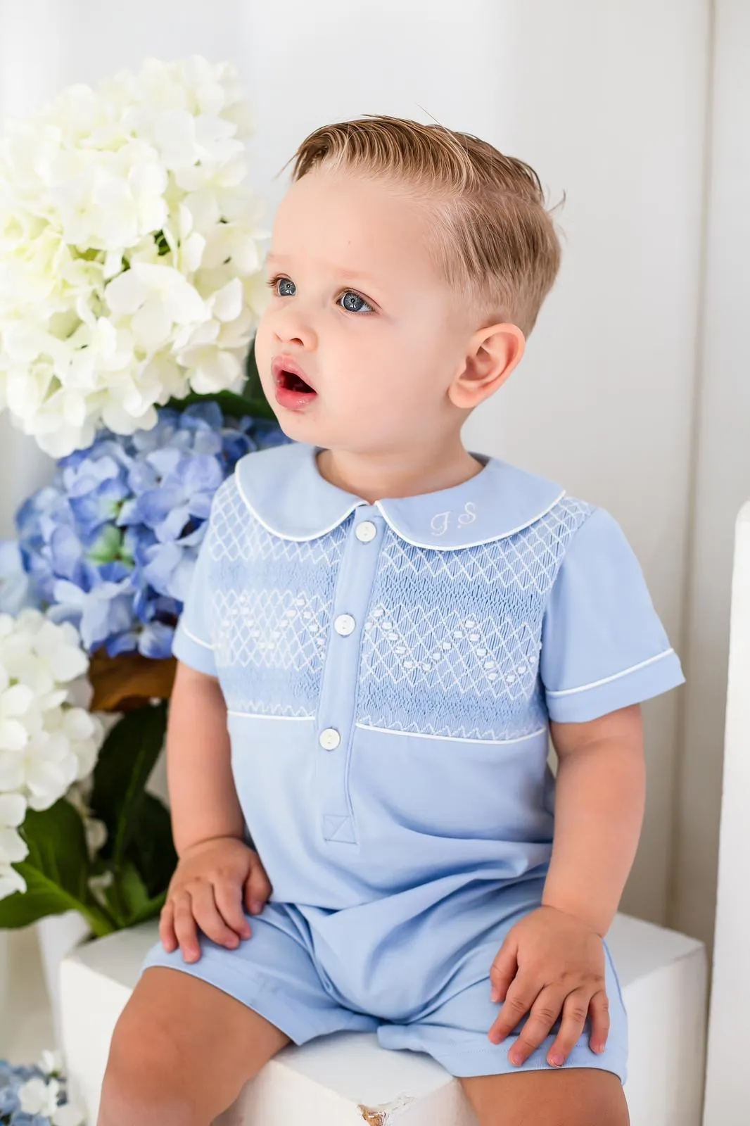 Boys Blue Smocked Romper Trimmed with White