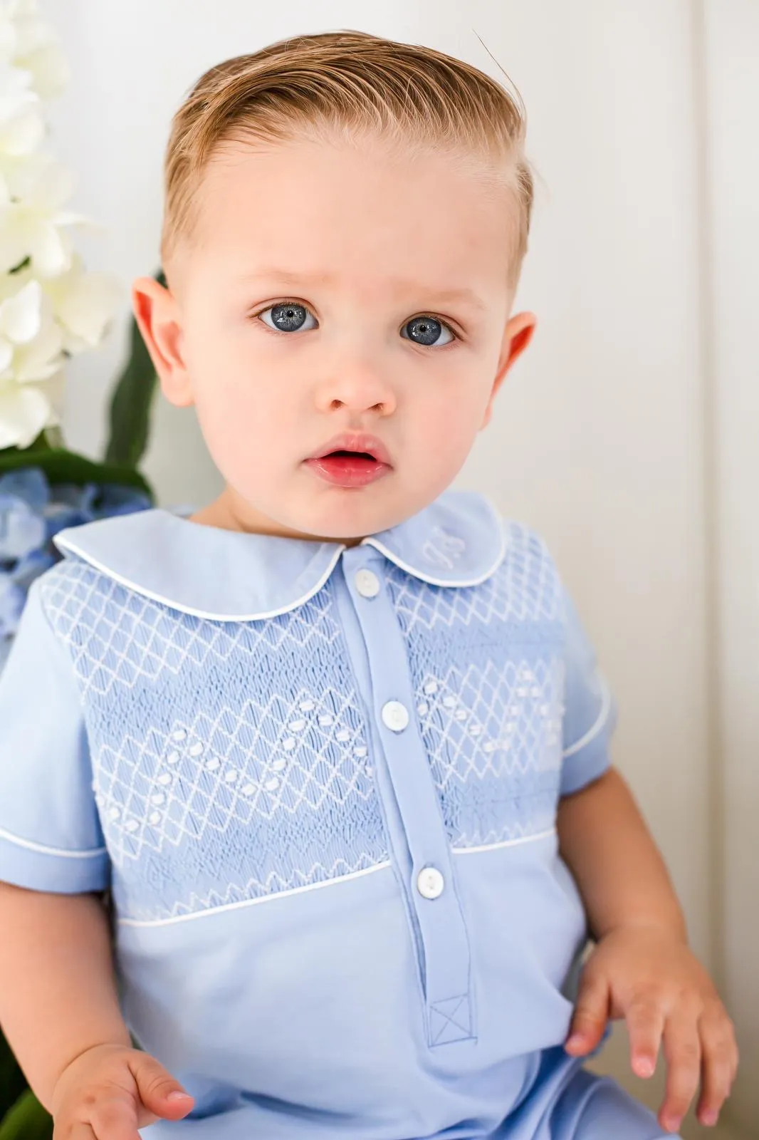 Boys Blue Smocked Romper Trimmed with White