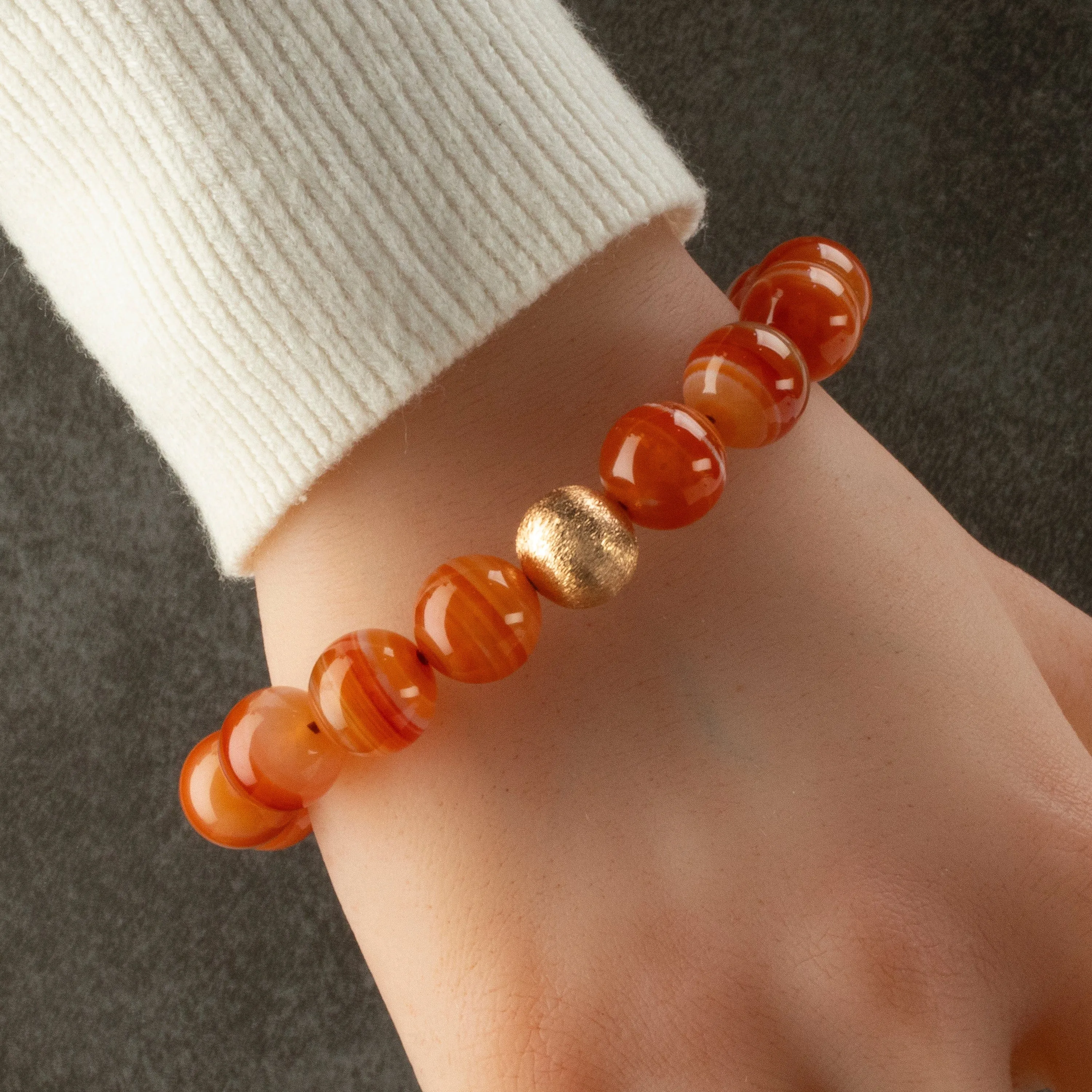 Polished Banded Carnelian 12mm Gemstone Bead Elastic Bracelet with Matte Gold Accent Bead